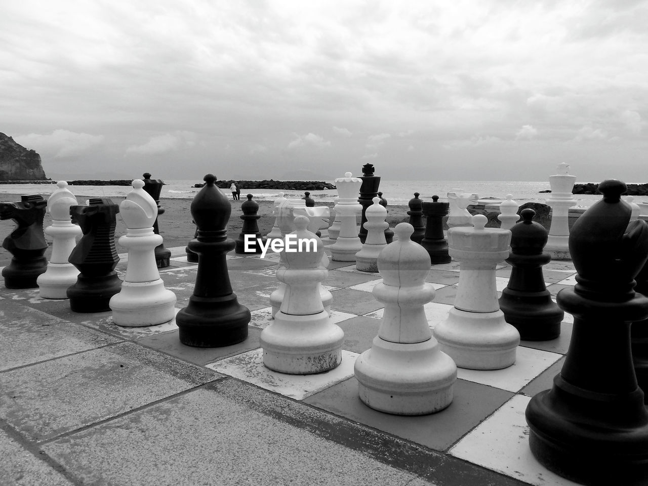 Full frame shot of chess board on sea against sky
