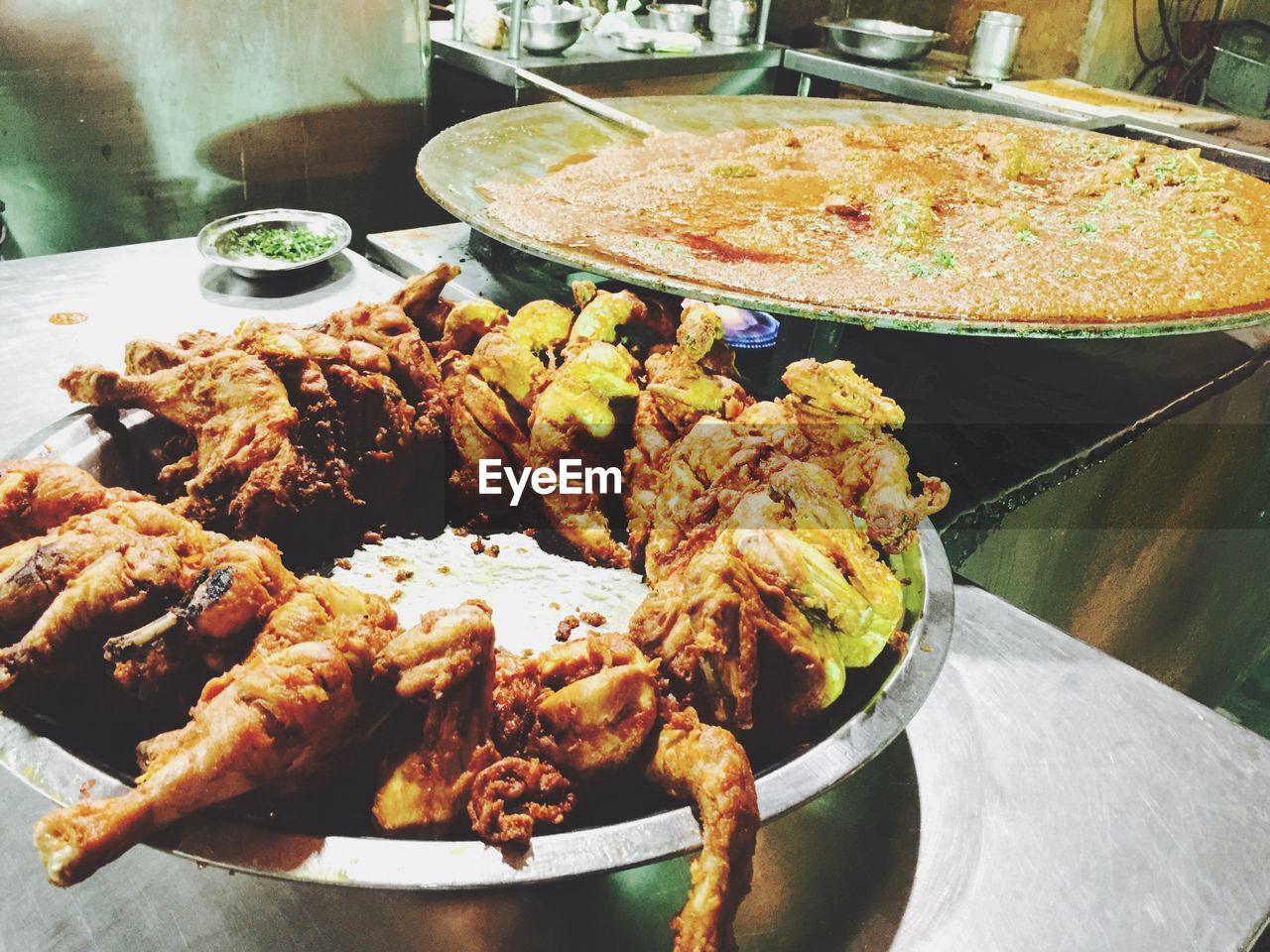 High angle view of fried chicken and curry in restaurant