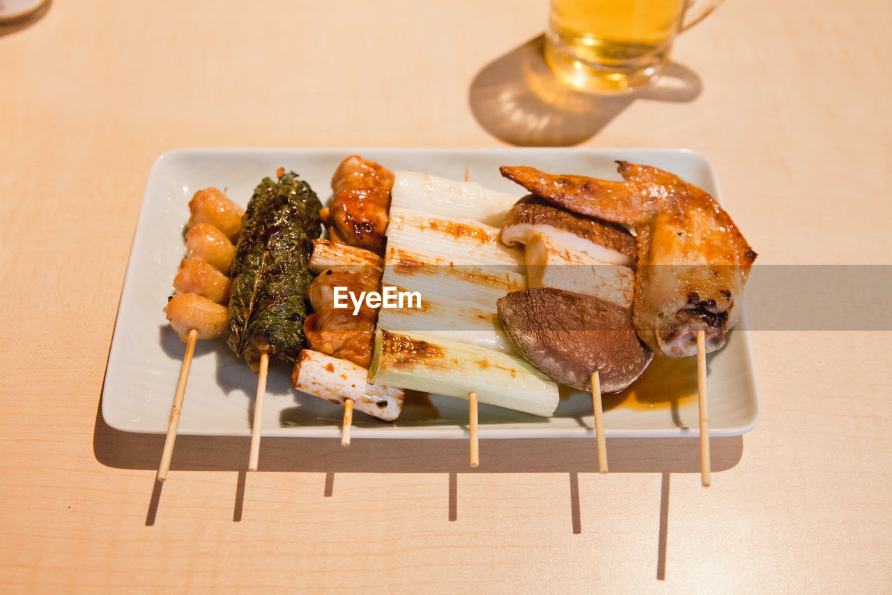 High angle view of yakitori served in plate on table