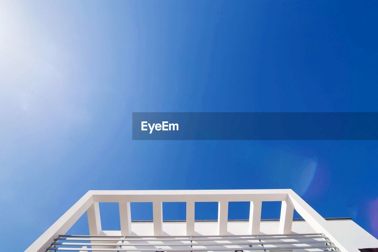 Low angle view of building against clear blue sky