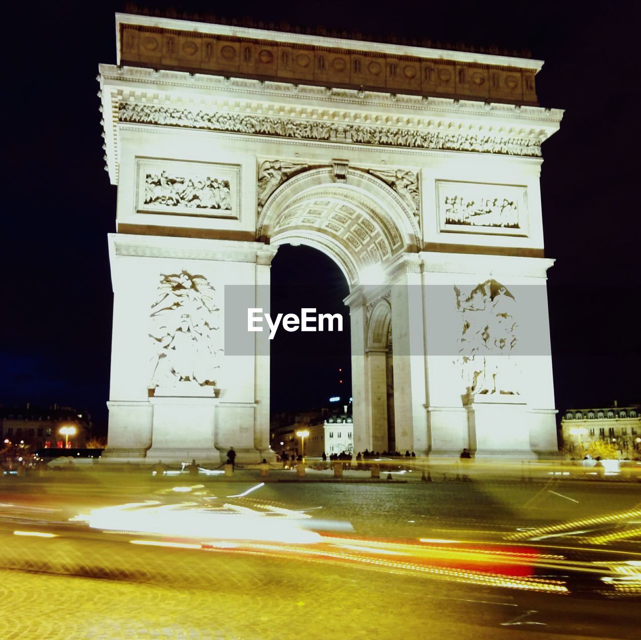 Low angle view of arc de triomphe at night
