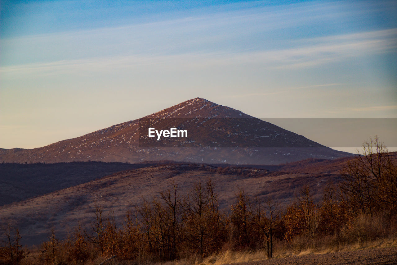 Scenic view of mountains against sky during sunset