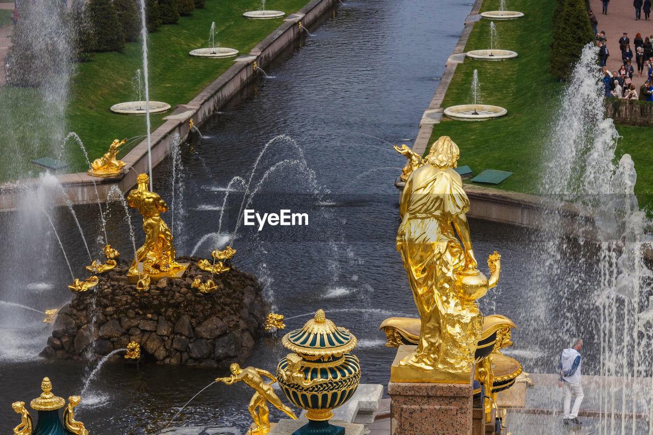 VIEW OF STATUE BY LAKE
