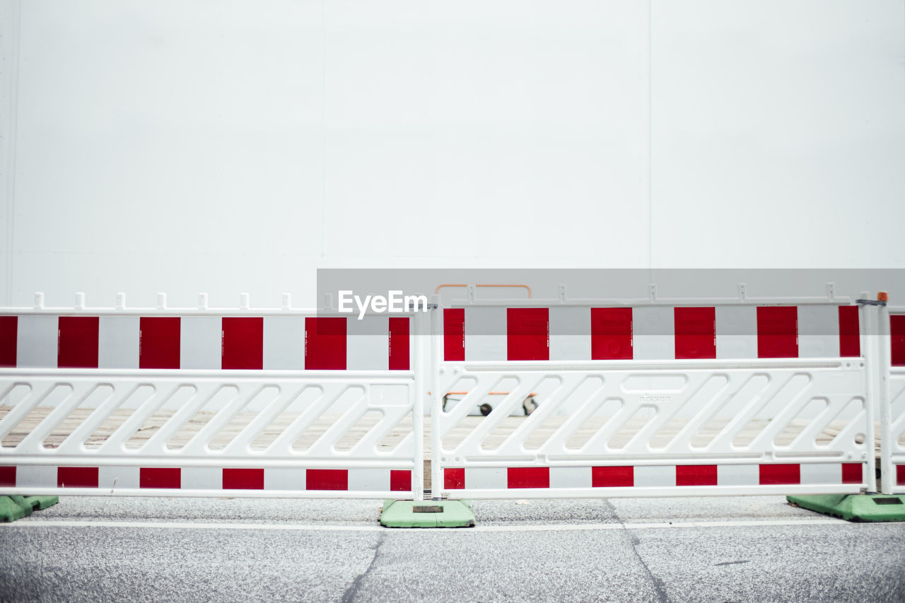 Full frame shot of road block against white wall 