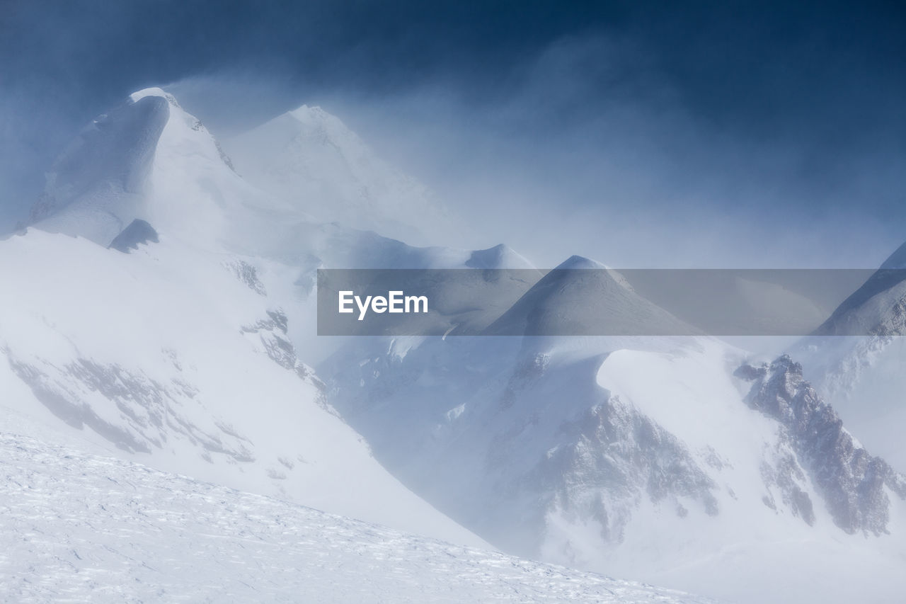 Scenic view of snowcapped mountains against sky. view from klein matterhorn, zermatt