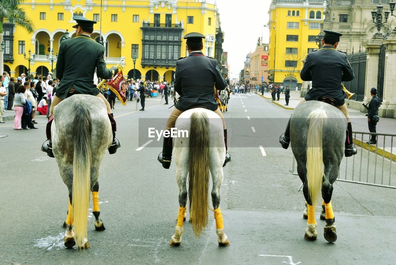 People riding horses during parade