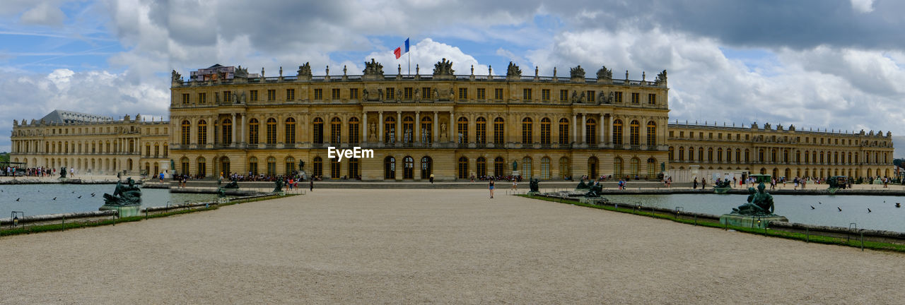 Buildings in city against cloudy sky in versailles 