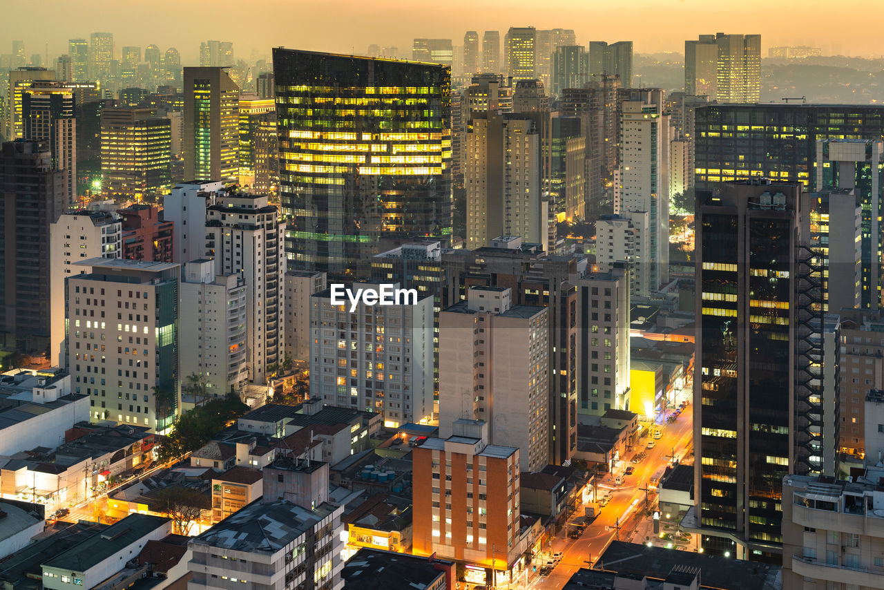 Aerial view of illuminated buildings in city