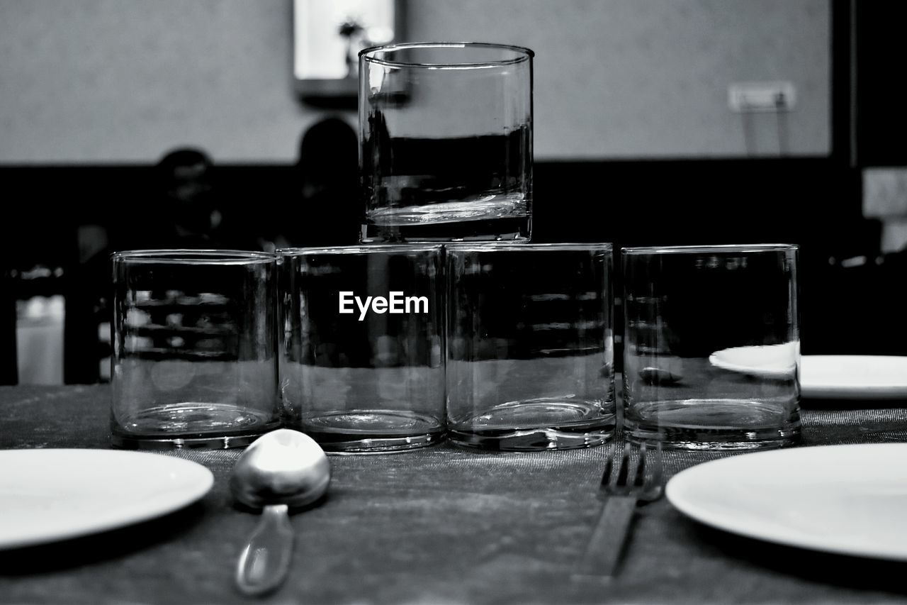 Glasses arranged on table at restaurant