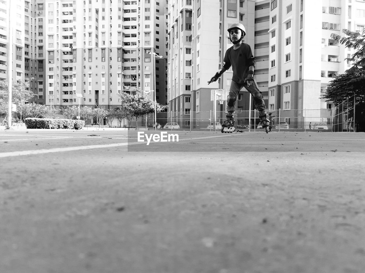 MAN RIDING BICYCLE ON STREET IN CITY