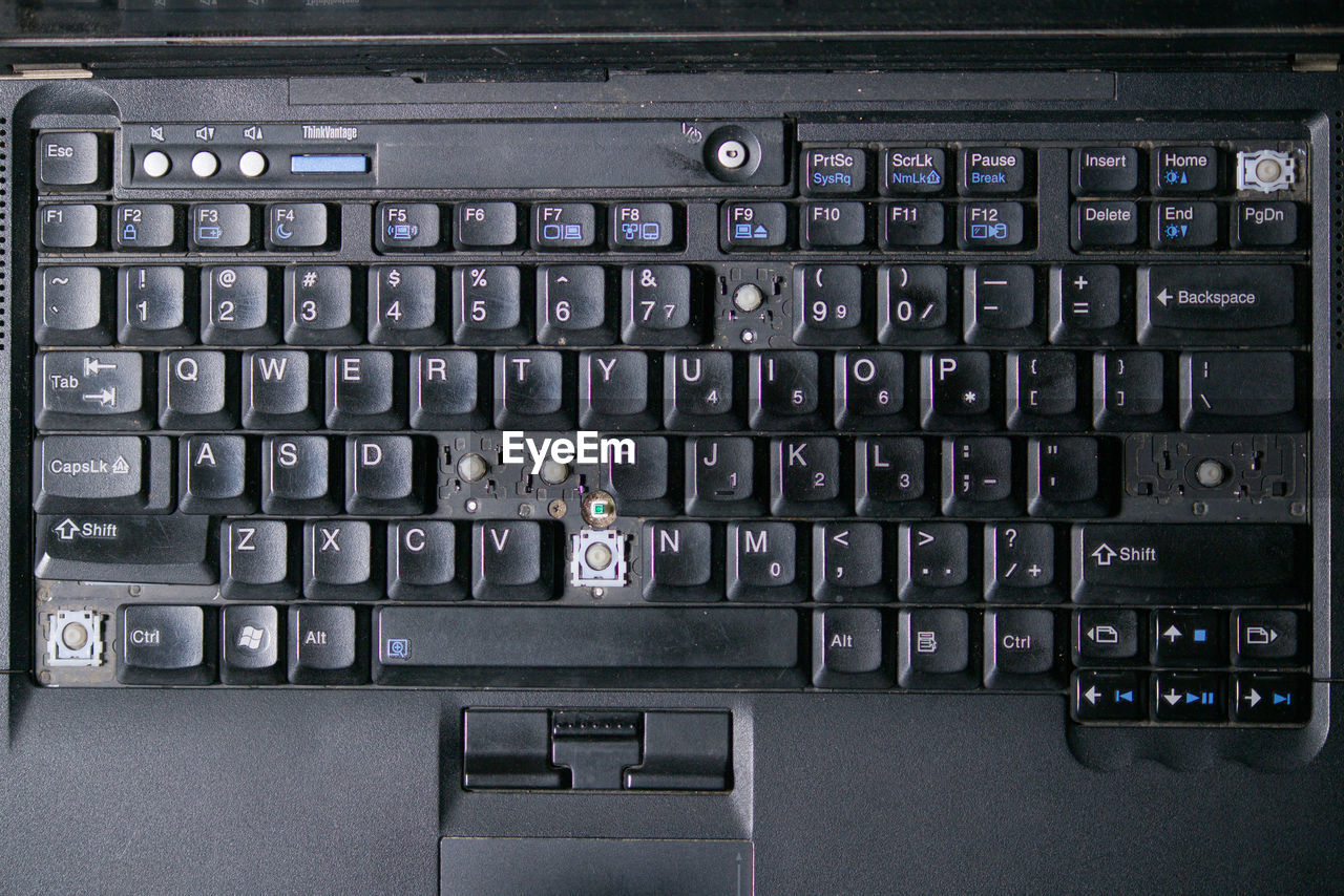 Full frame shot of computer keyboard with broken keys