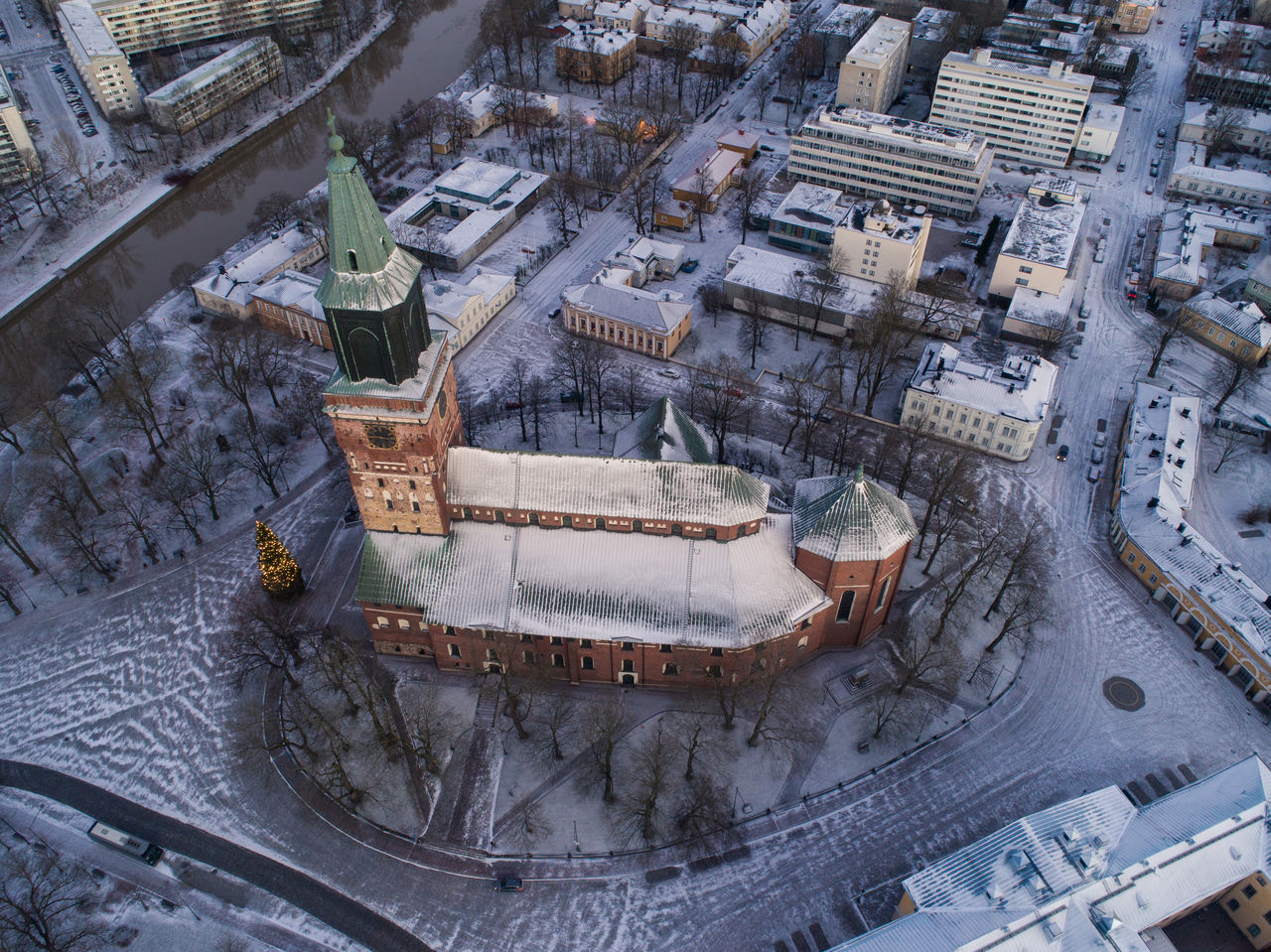 Aerial view of illuminated historic church during sunset