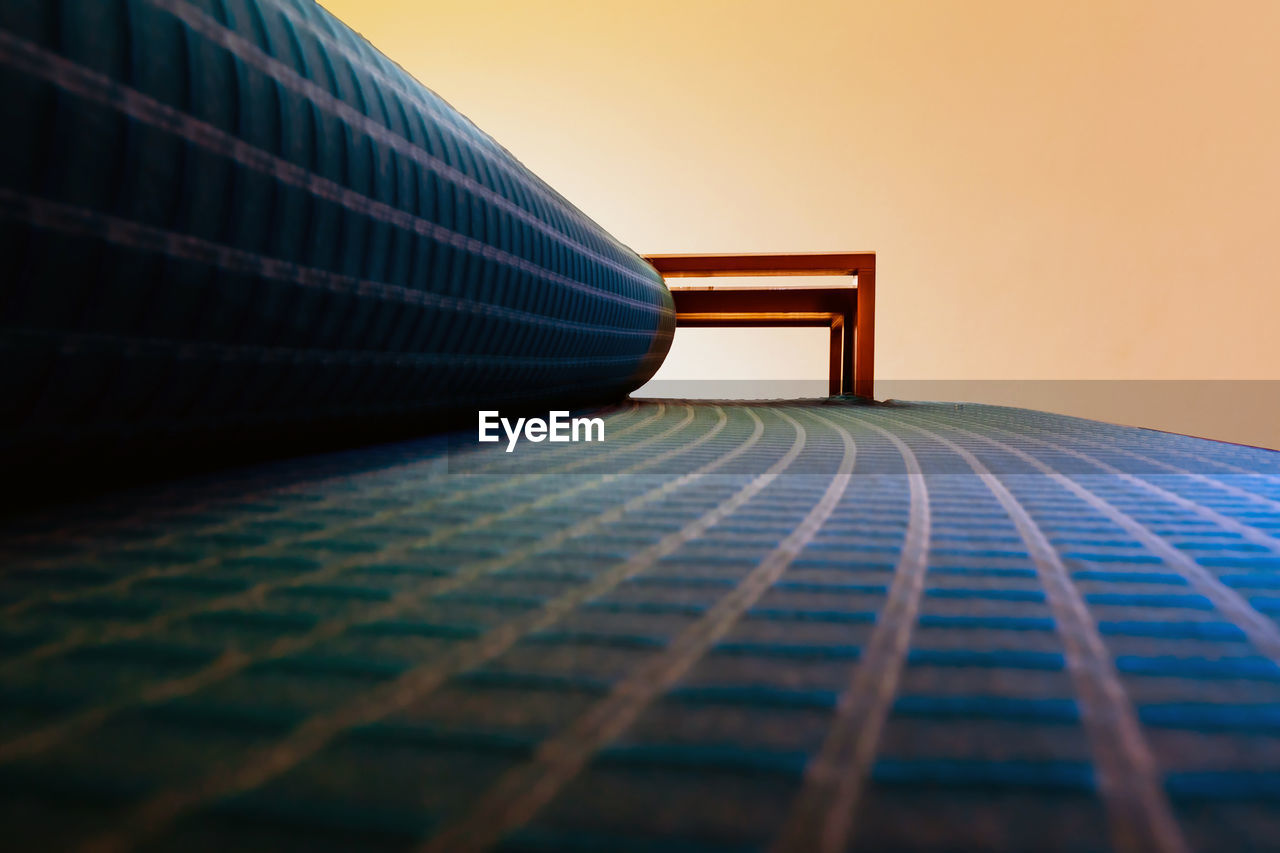 Close-up of sofa against blue sky