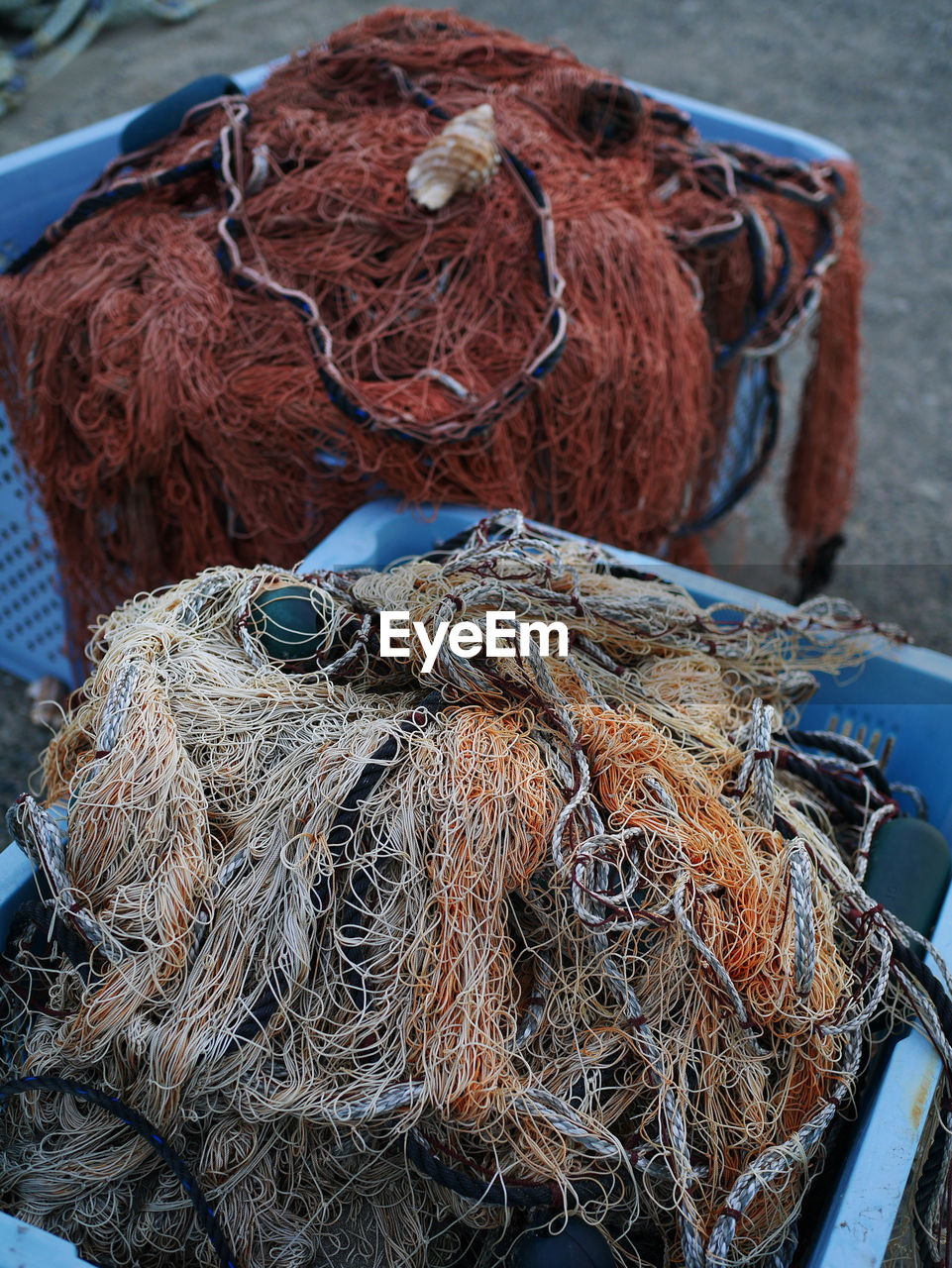 fishing net, fishing, fishing industry, commercial fishing net, rope, fishing rod, buoy, no people, nautical vessel, rod, harbor, day, art, transportation, blue, water, outdoors, mode of transportation, high angle view, close-up, nature, thread