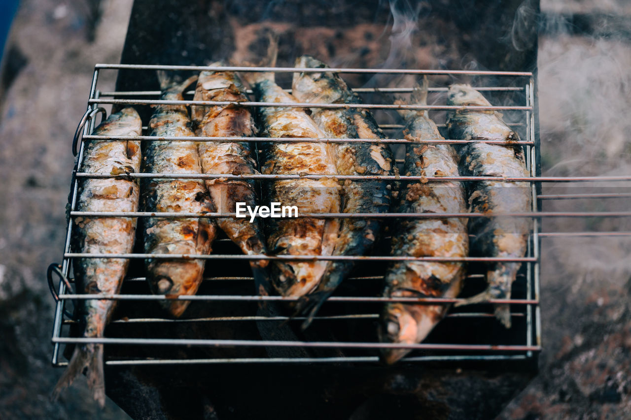 High angle view of fish being grilled on barbecue