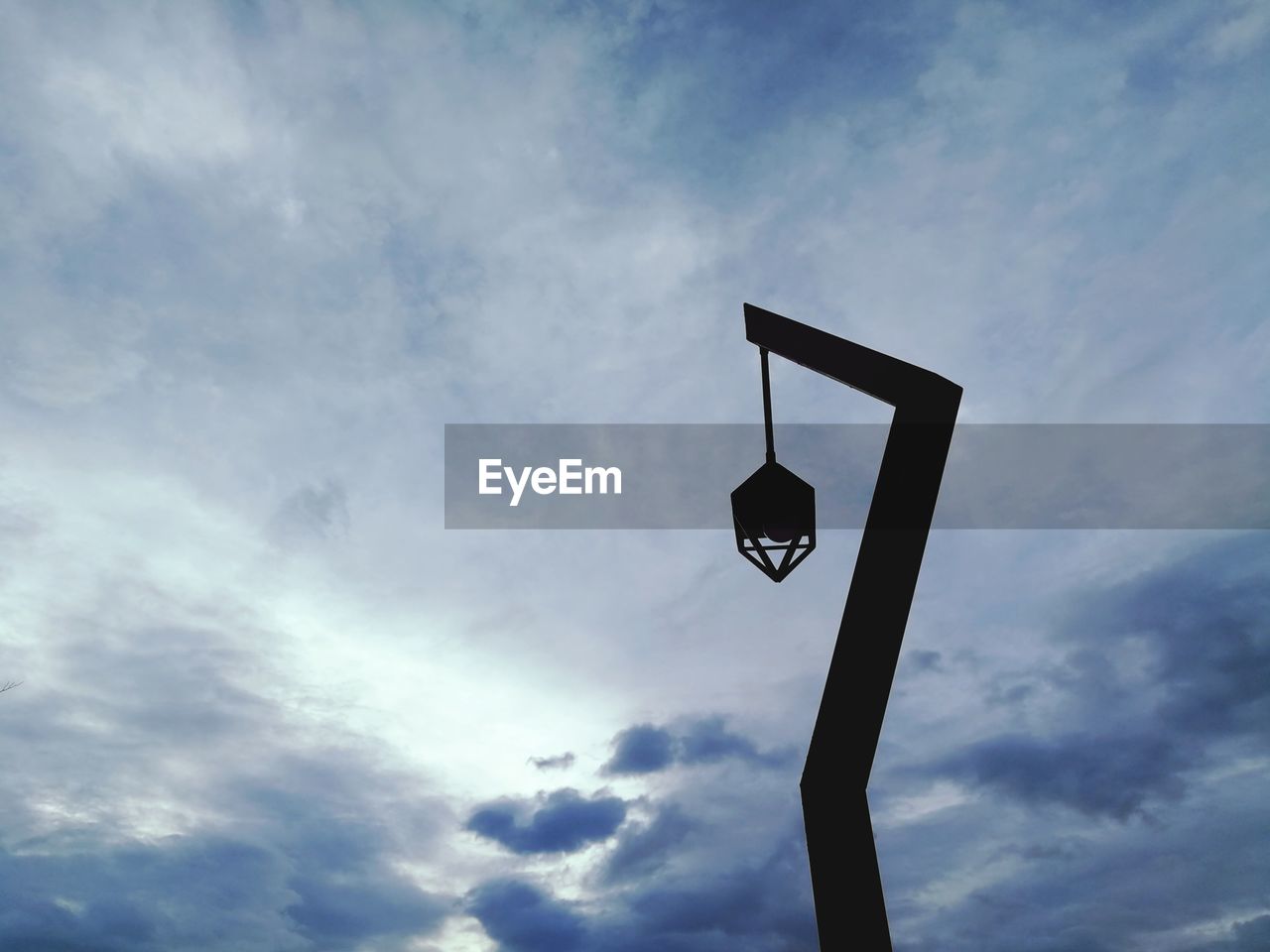 Low angle view of street light against sky