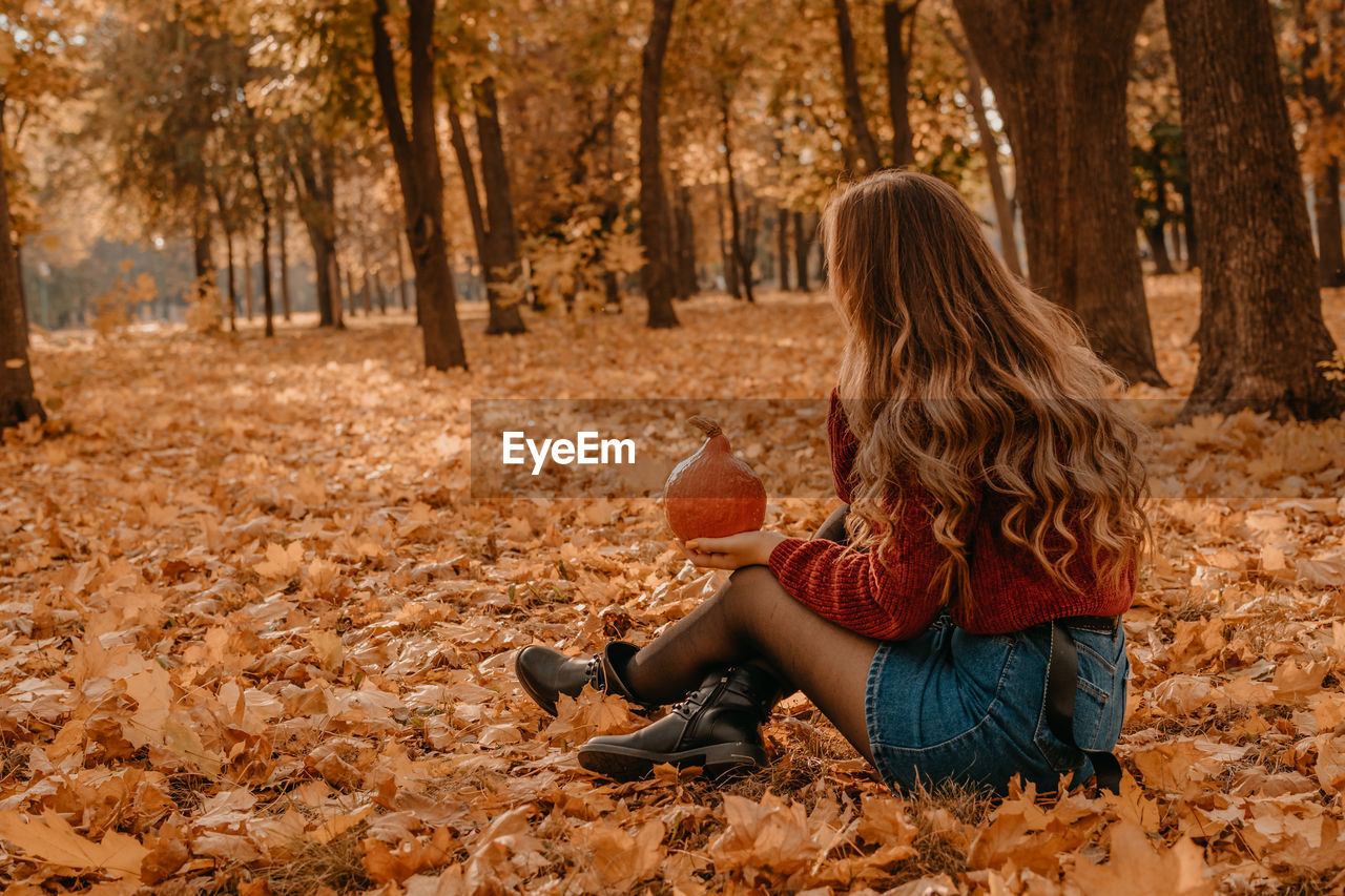 Woman sitting in autumn