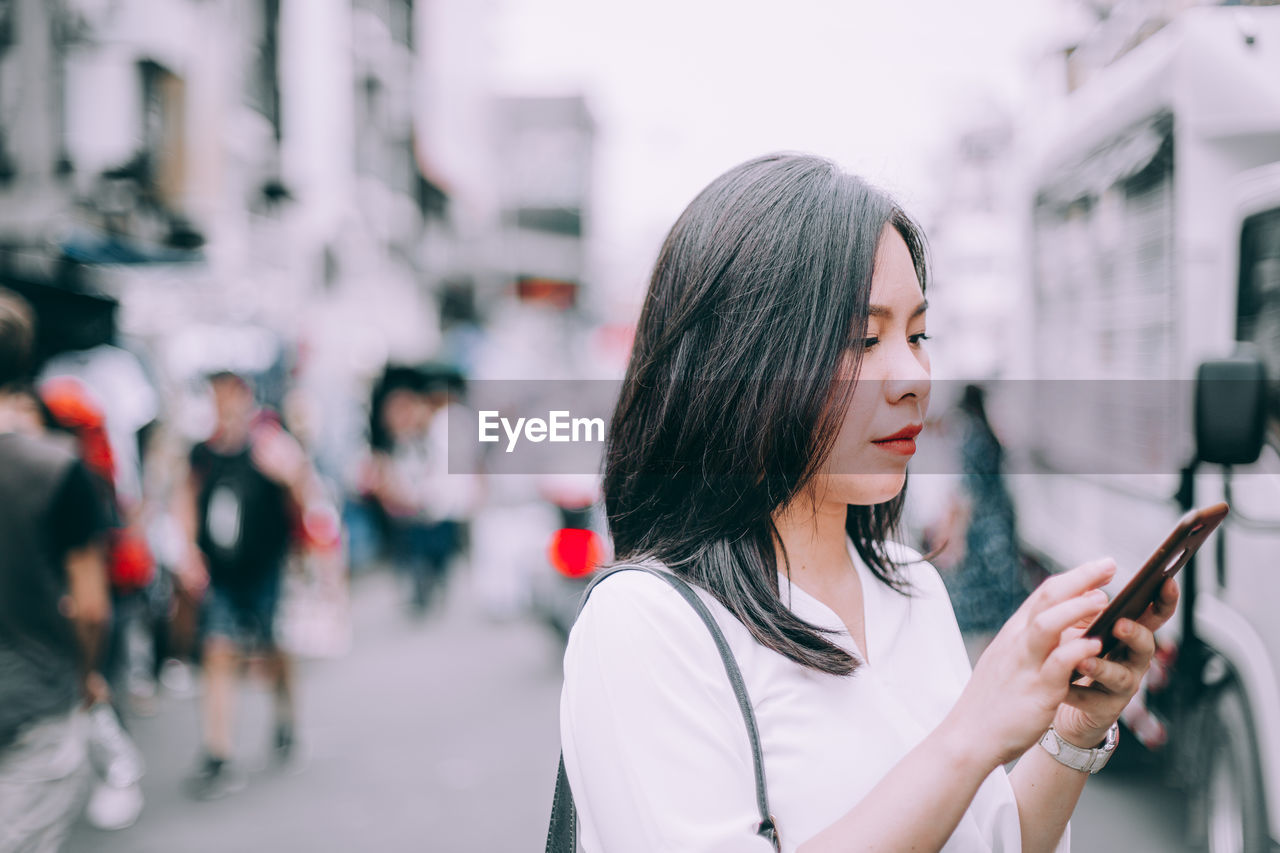 young woman using mobile phone