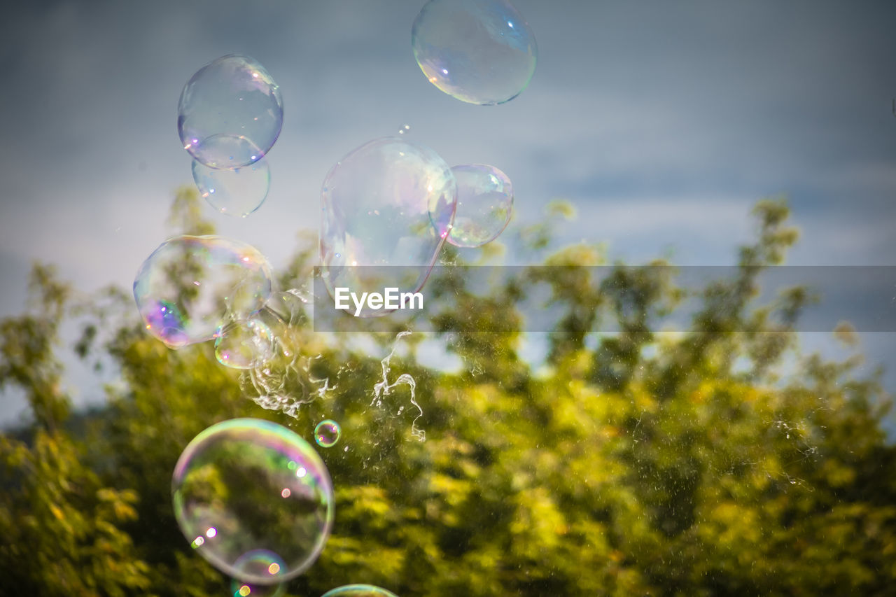 CLOSE-UP OF BUBBLES IN MID-AIR
