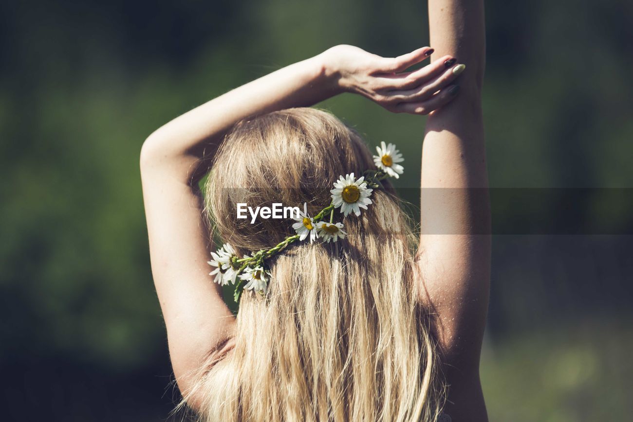 Rear View Of Woman Wearing Flowers On Hair Id 98938892