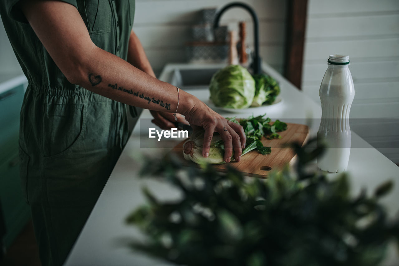 Midsection of man preparing food at home