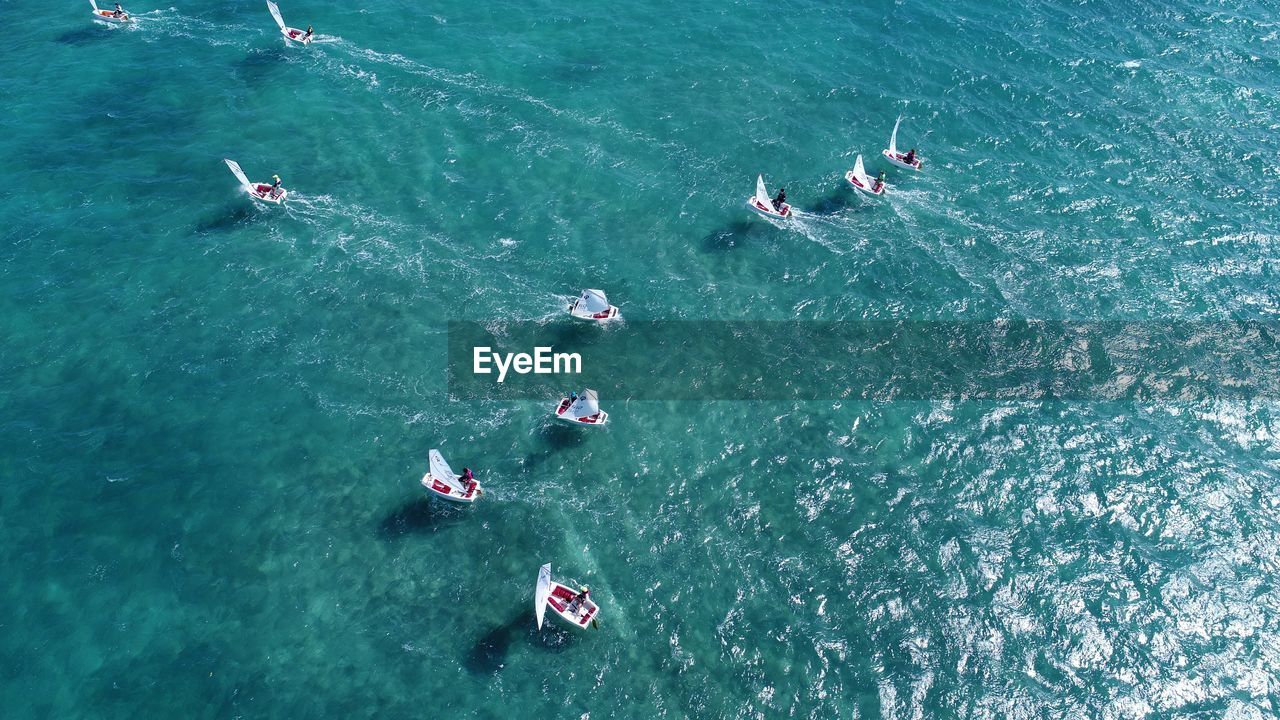 High angle view of people sailing boats on sea