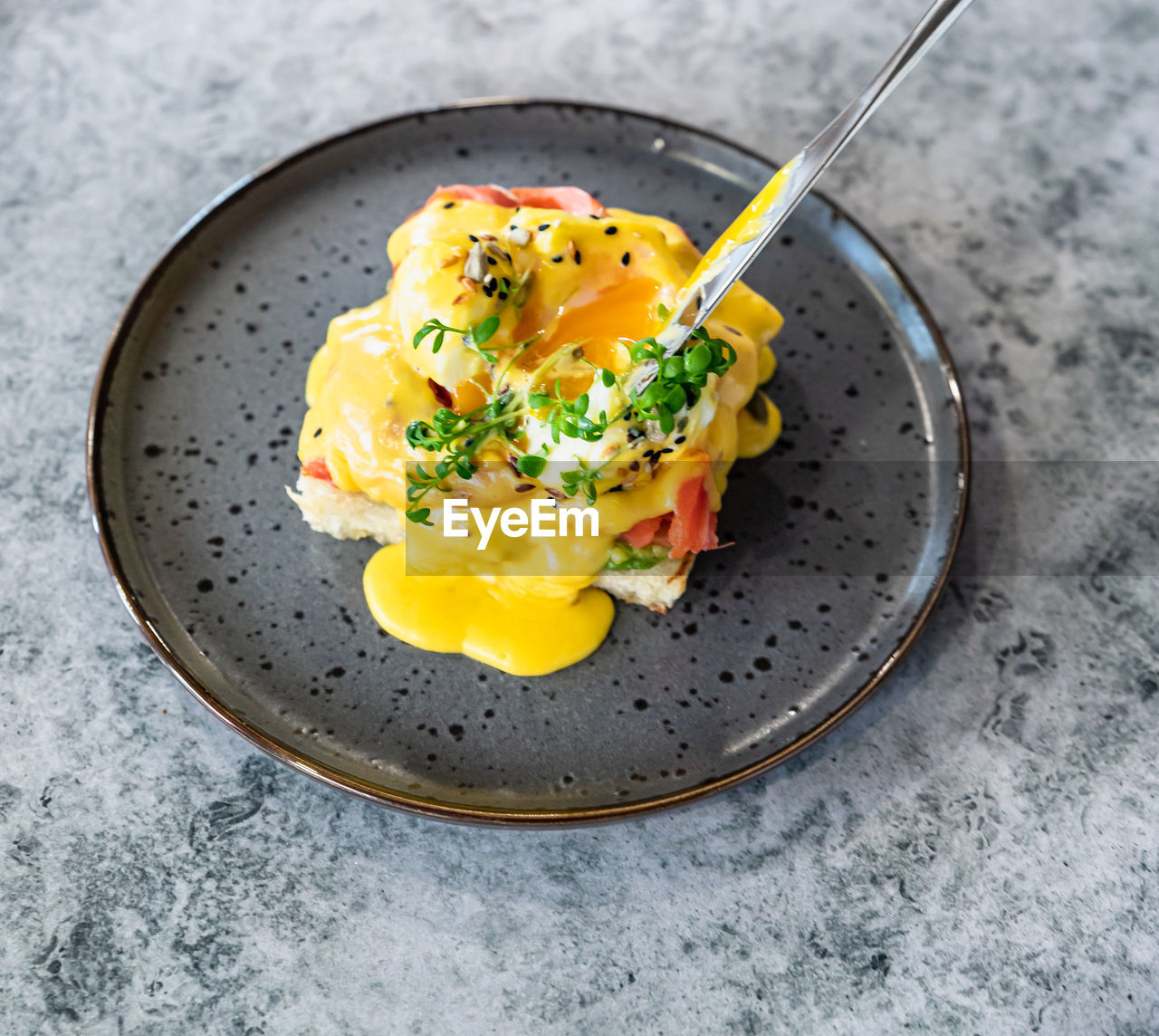 food and drink, food, healthy eating, egg, wellbeing, dish, freshness, kitchen utensil, meal, plate, eating utensil, egg yolk, produce, breakfast, fried, vegetable, indoors, high angle view, no people, fried egg, fork, cuisine, yellow, gray, garnish, close-up, spoon