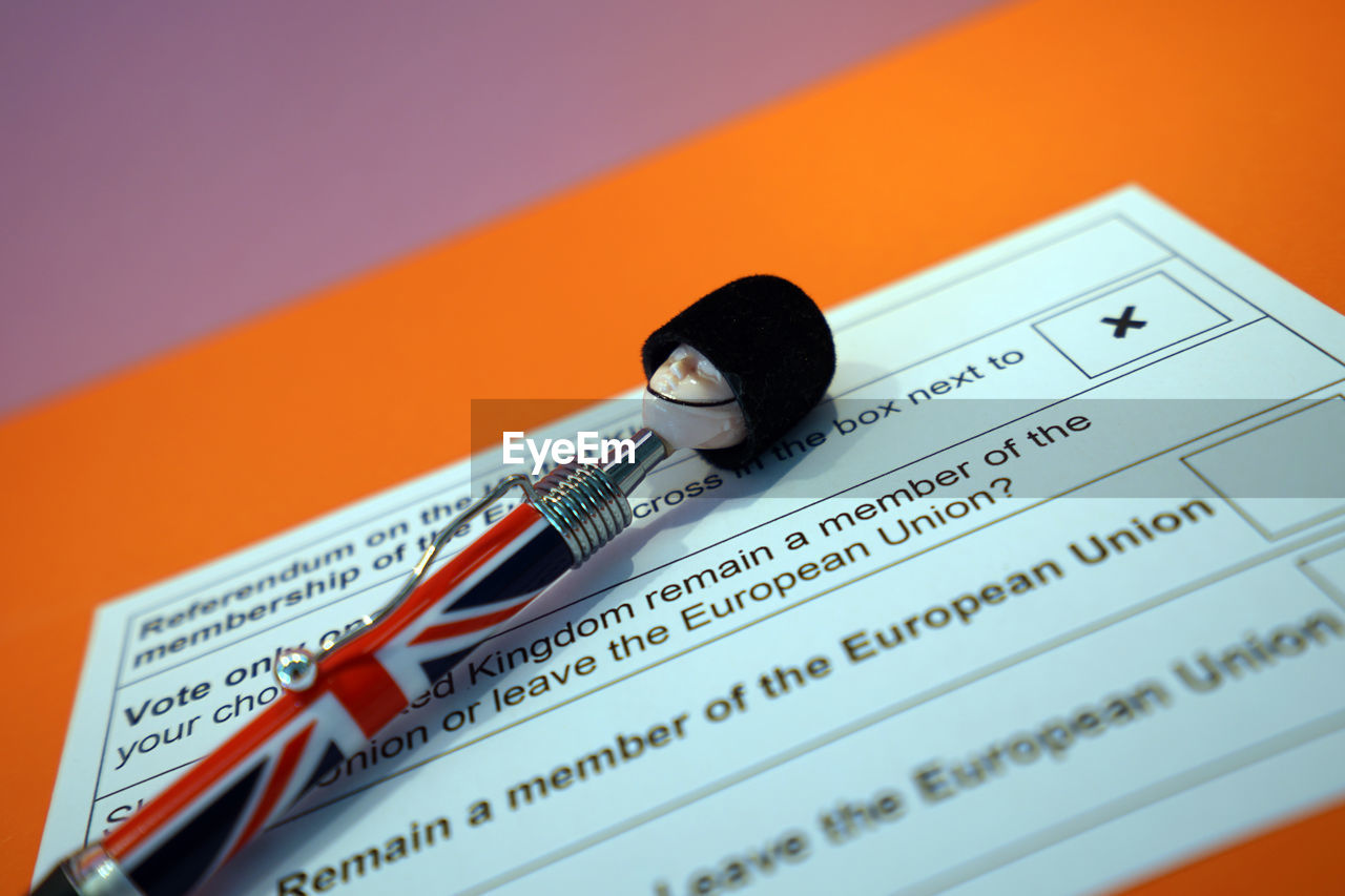Close-up of british pen with ballot slip on table