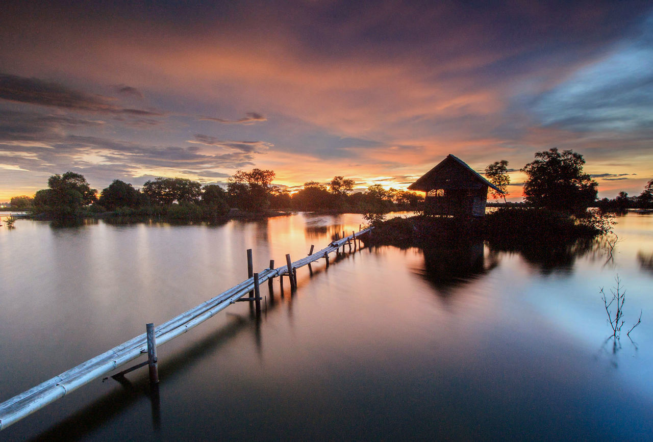 Scenic view of lake against sky during sunset