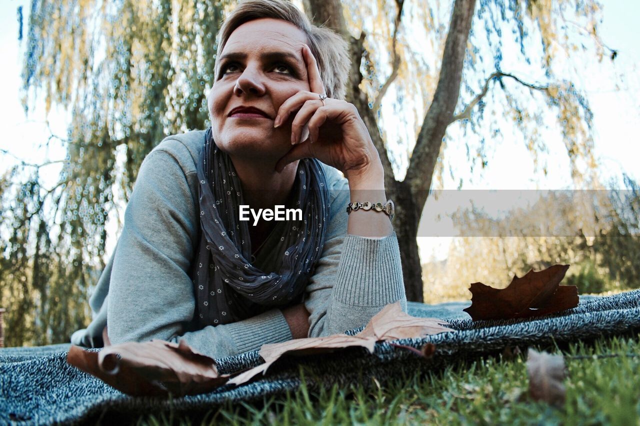 Woman lying in grass