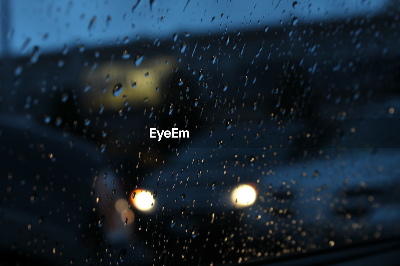 RAIN DROPS ON WINDOW OF CAR