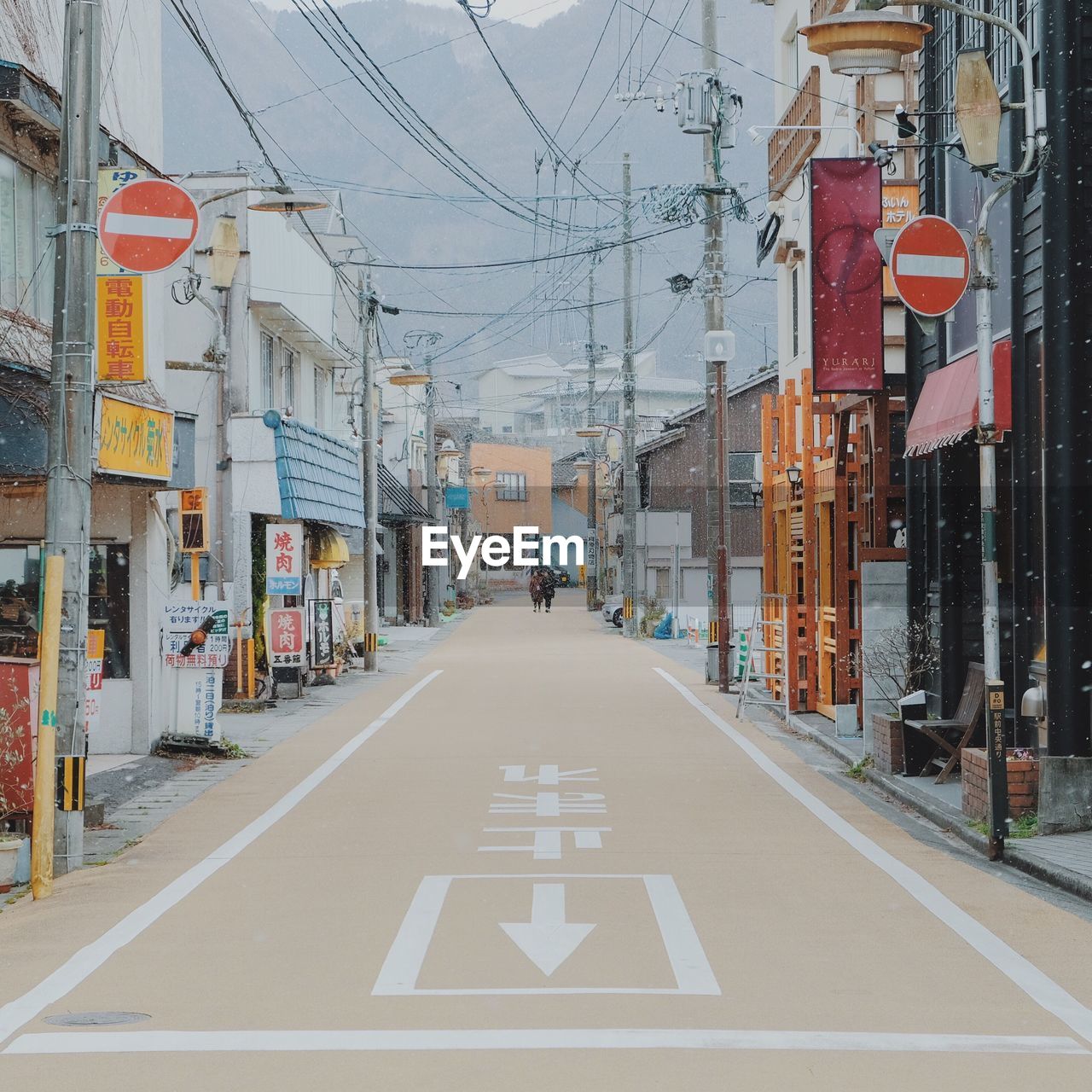 ROAD AMIDST CITY STREET