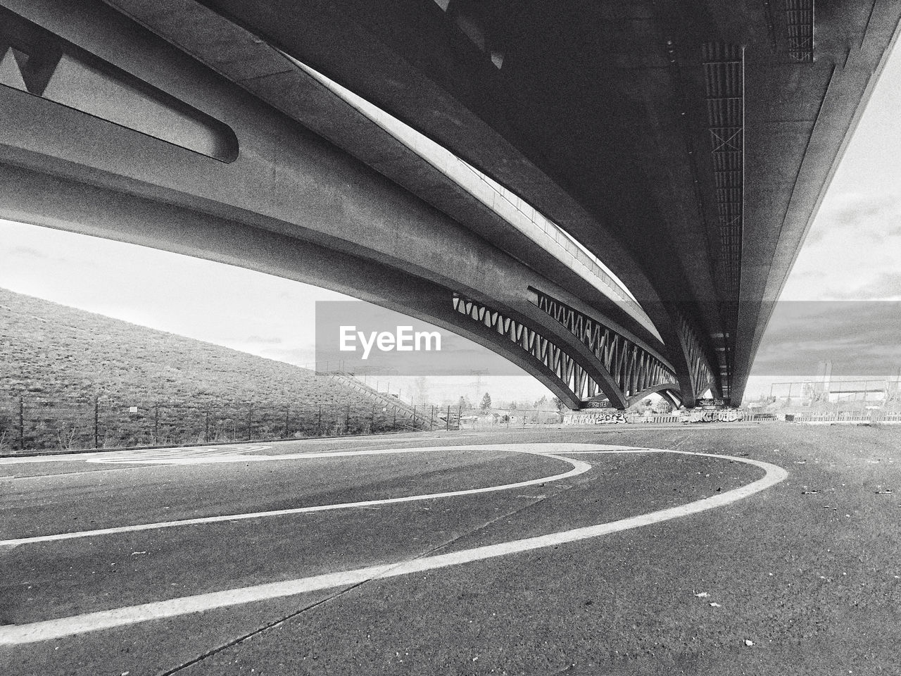 View of futuristic bridge over road in city