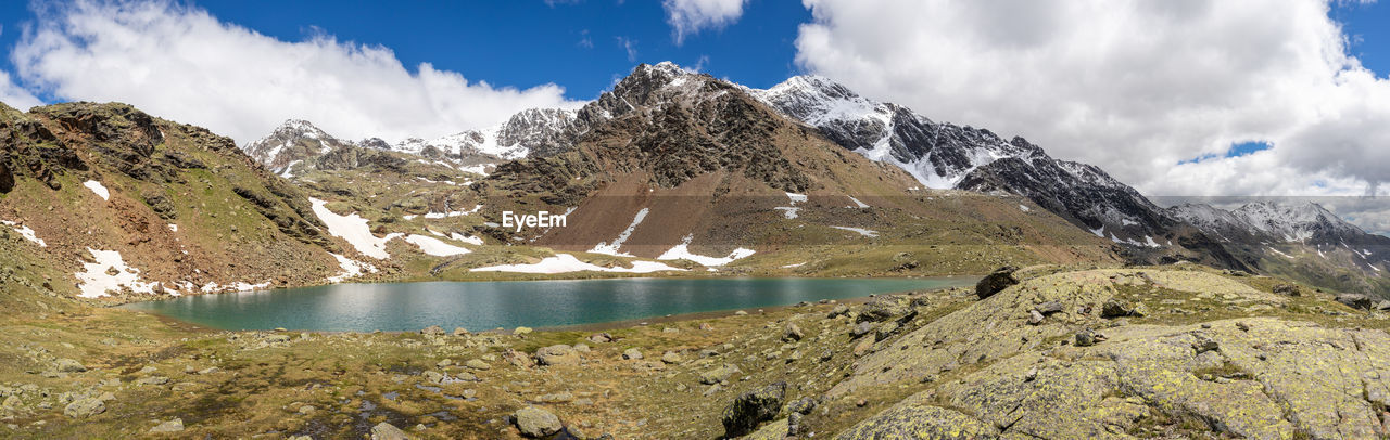 PANORAMIC SHOT OF SNOWCAPPED MOUNTAINS AGAINST SKY