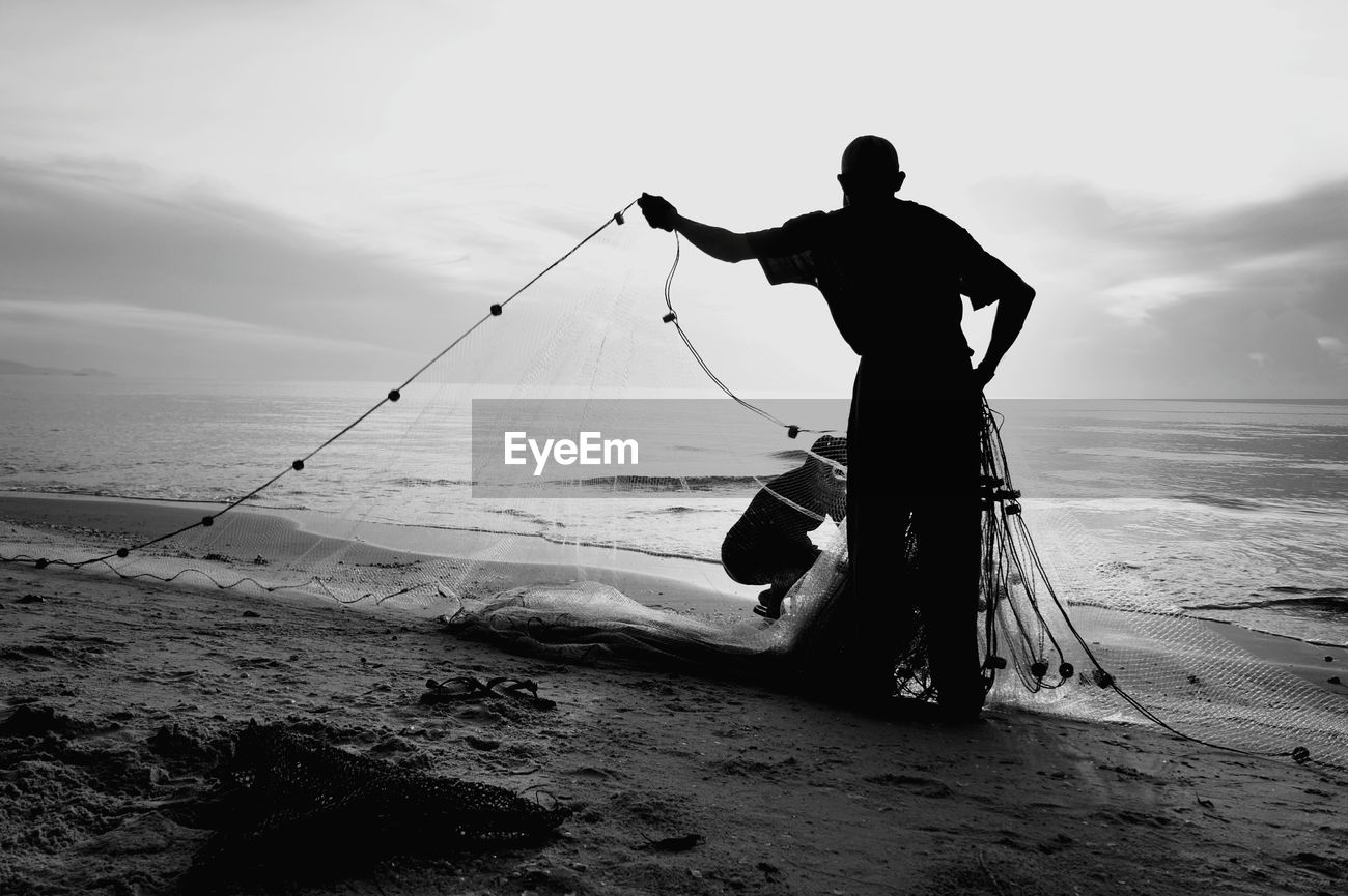 Get Wallpaper Silhouette Man And Woman Fishing At Beach Id 108905998 Desktop Wallpaper