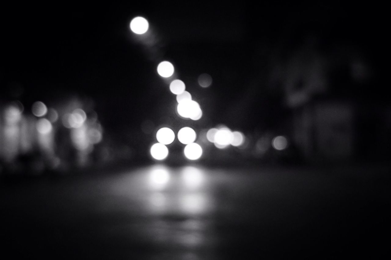 HIGH ANGLE VIEW OF ILLUMINATED STREET LIGHTS AT NIGHT