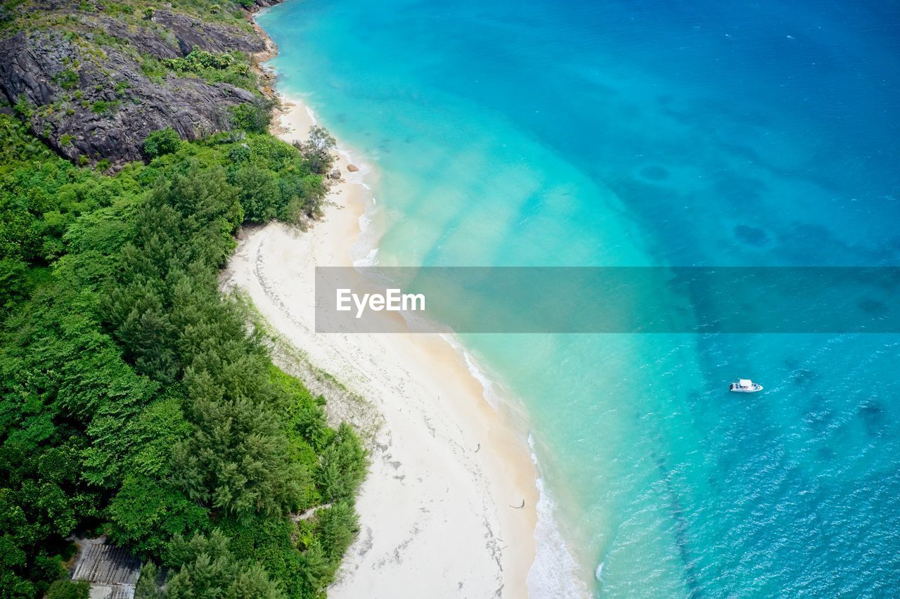 Drone field of view of coastline and forest curieuse island, seychelles.