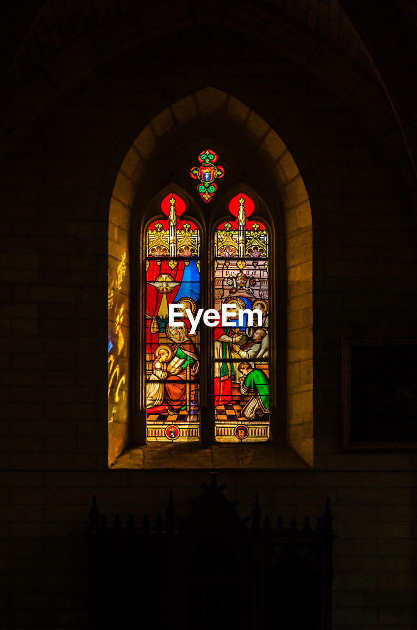 COLORFUL WINDOW IN CHURCH