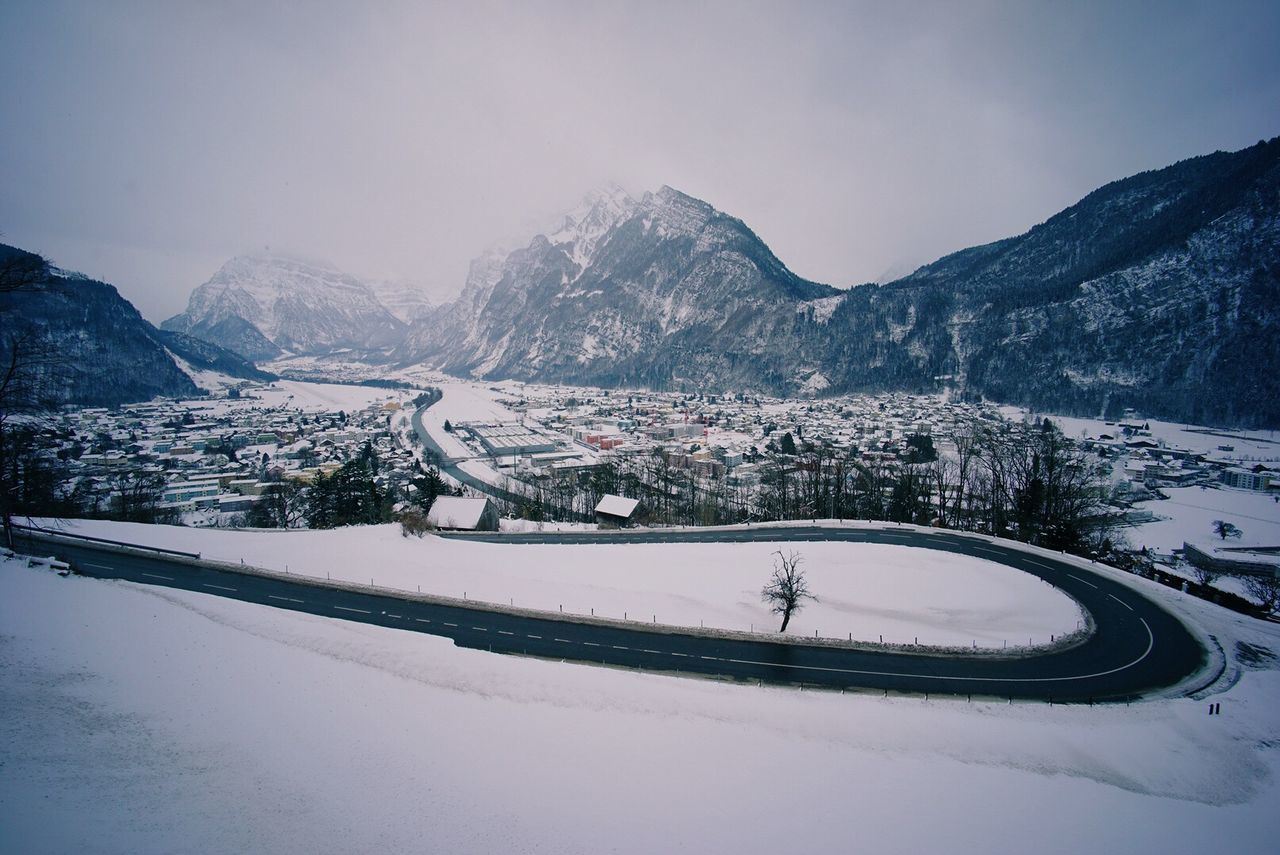 High angle view of winding road at mountain during winter