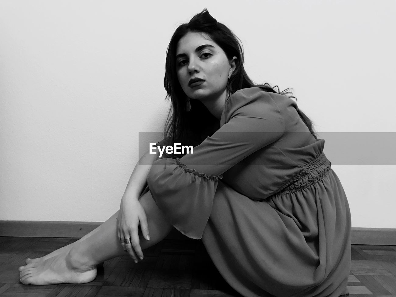 Side View Portrait Of Young Woman Sitting Id 119379757 Lie down and bend your knees, adjusting your body so that your toes touch the wall. eyeem