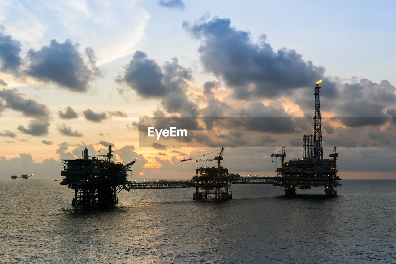 Silhouette of oil production platform during sunset at offshore terengganu oil field
