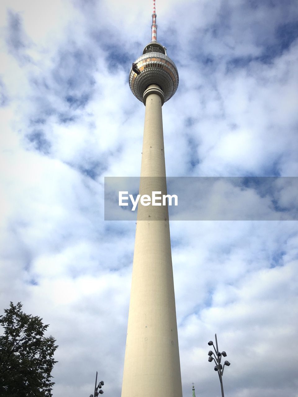 LOW ANGLE VIEW OF COMMUNICATIONS TOWER IN CITY