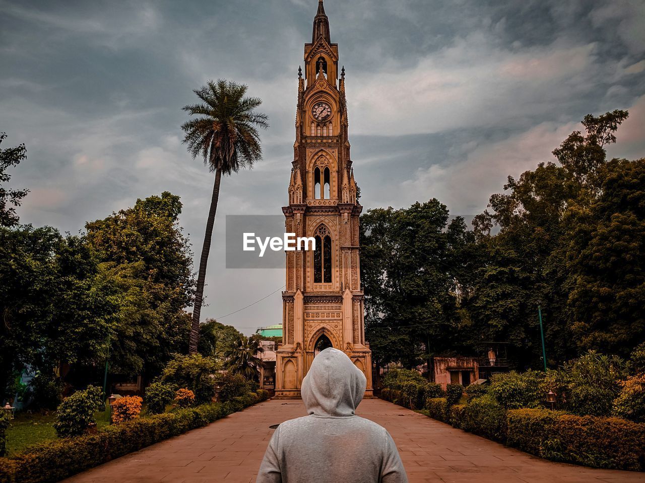 Traveller looking at a clocktower 