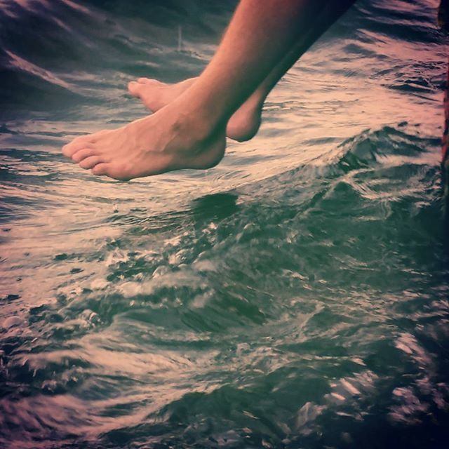 WOMAN STANDING IN WATER