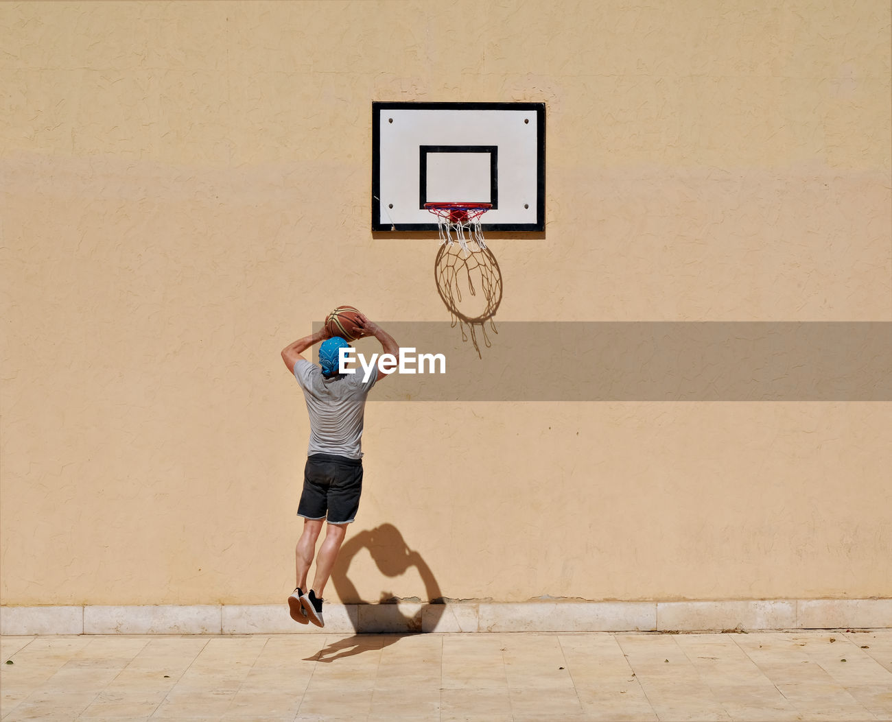 Full Length Of Man Playing Basketball Id 102323058
