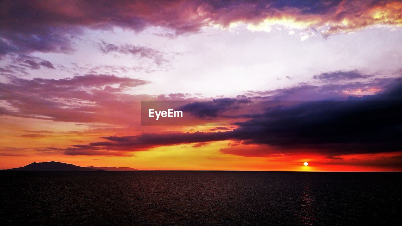 Scenic view of dramatic sky over sea