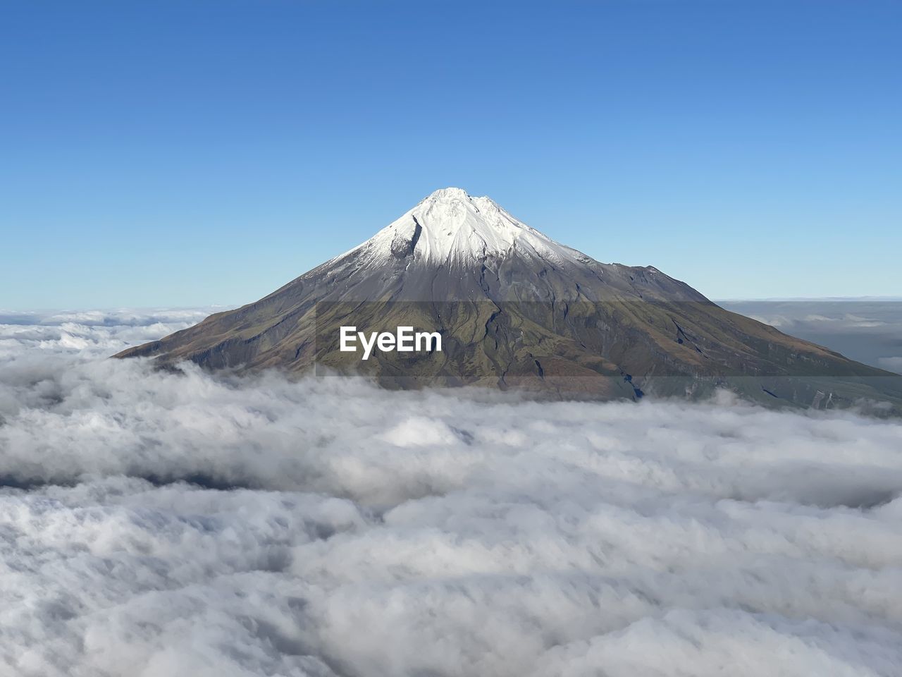 Scenic view of snowcapped volcano against clear sky
