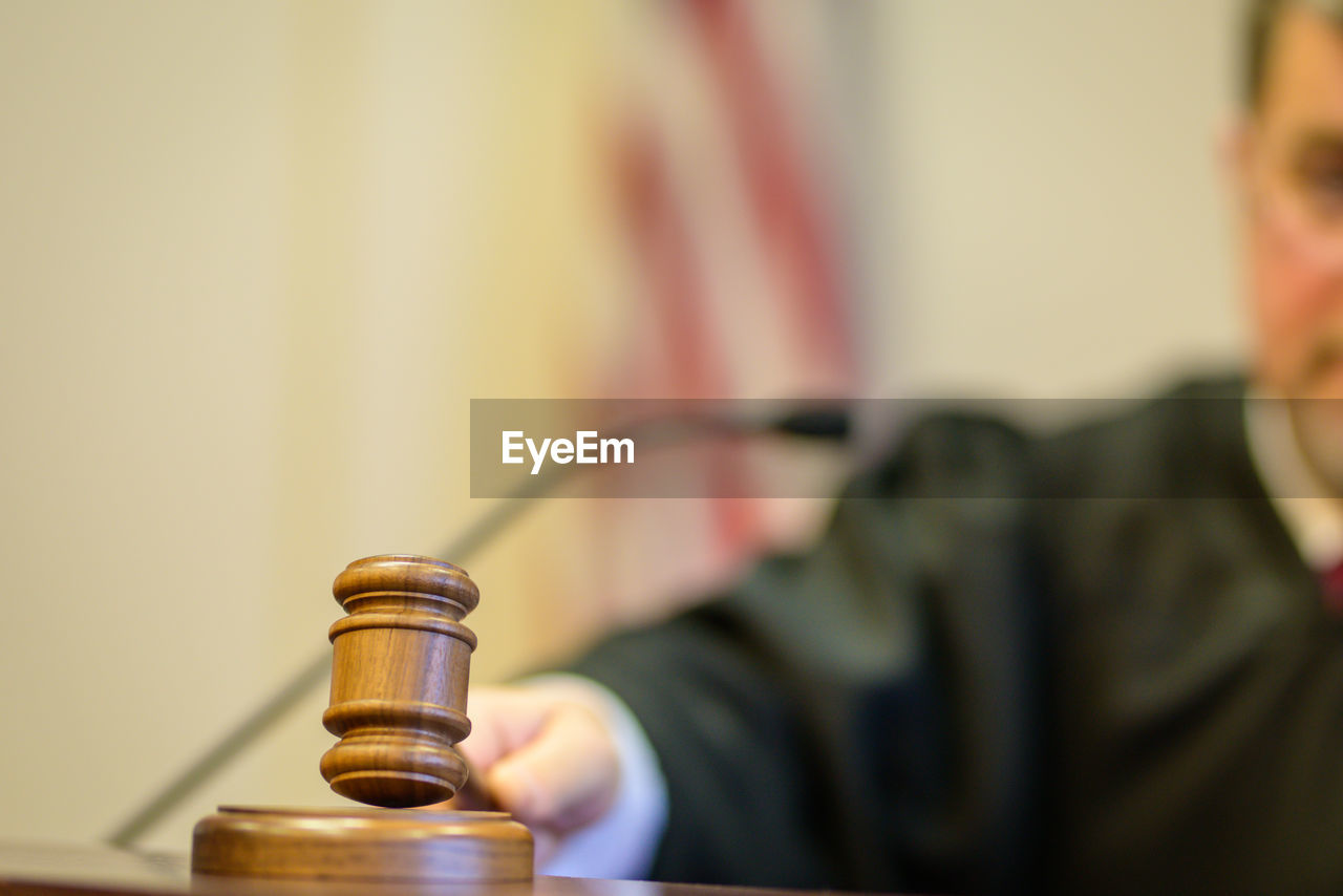 Close-up of judge banging gavel in court