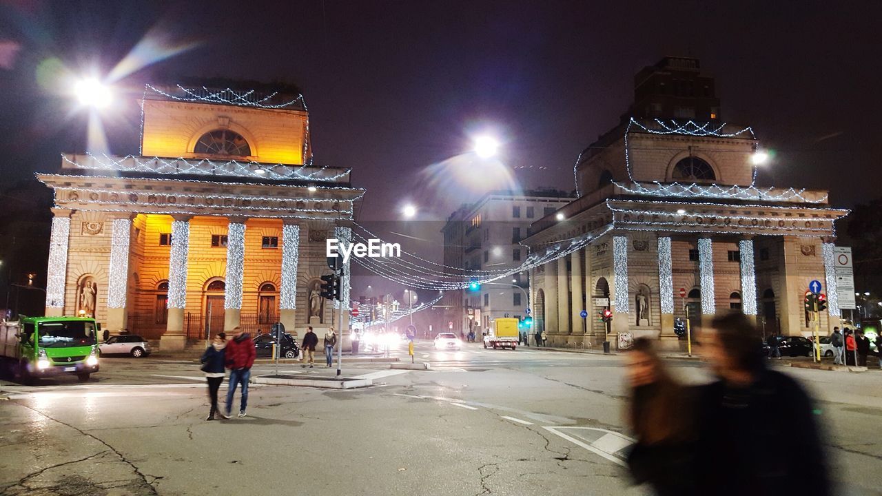 VIEW OF ILLUMINATED BUILDINGS AT NIGHT