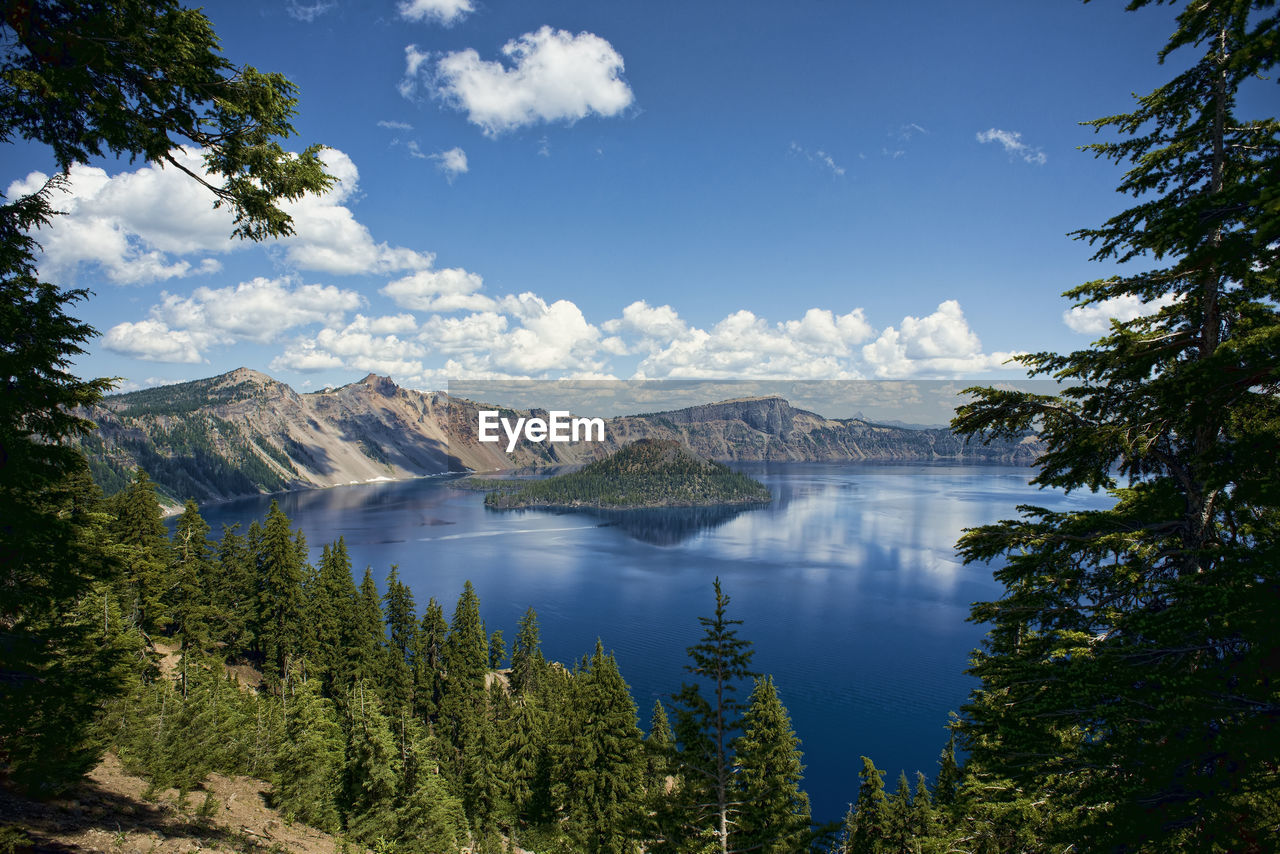 Scenic view of crater lake against blue sky